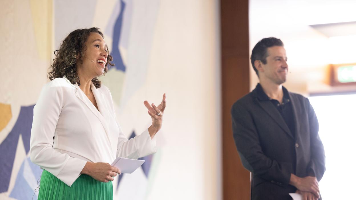 Two company representatives giving a presentation to students in a campus seminar setting.